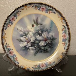A Lena Liu "Flights of Fancy" collector plate, titled "Garden Jewels".